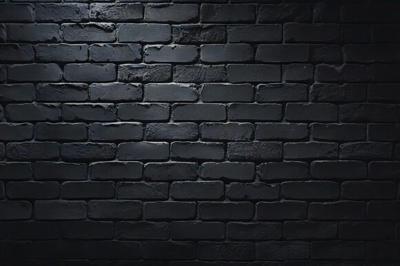 A Black Brick Wall with Light Shining On: A Versatile Design Resource